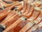 Bunch and pile of cut frozen orange salmon at the supermarket grocery store. Close up shot.