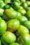 Bunch Pile of Ripe Vibrant Green Mangoes at Farmers Market in Asia. Bright Sunlight. Travel Lifestyle Image. Vitamins Superfoods
