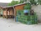 Bunch of plastic storage boxes near a wooden construction with table and chairs