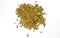 A bunch of pure gold granules isolated on a white background