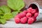 A bunch of raspberries on a wooden table close-up. Berry harvesting concept