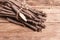 Bunch of raw Scorzonera or Spanish salsify on vintage wooden table