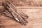 Bunch of raw Scorzonera or Spanish salsify on vintage wooden table
