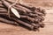 Bunch of raw Scorzonera or Spanish salsify on vintage wooden table