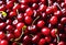 a bunch of red cherries are on display at the market