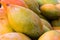 Bunch of rip mangoes background, close-up