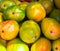 Bunch of ripe colorful red yellow green mangoes at asian farmers market. Summer tropical fruits vitamins travel concept