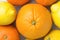 Bunch of Ripe Juicy Whole Citrus Fruits Oranges Tangerines Lemons on White Stone Marble Table. Vitamins Healthy Diet Summer Detox