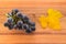 Bunch of ripe Pinot Noir grapes on wooden chopping board