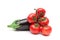 bunch of ripe tomatoes and eggplant close up on a white background