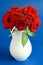 Bunch of roses in a vase, vase with beautiful red roses on white, bouquet of blossoming pink roses in vase