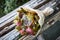 Bunch of rotten fruit and wilted flowers lay on old wooden boards