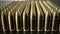 Bunch of shiny 9 mm brass ammo on dark wooden desk