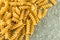 Bunch of sprial golden colored macaroni pasta