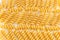 Bunch of sprial golden colored macaroni pasta