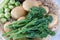 Bunch of Tenderstem Broccoli on a bed of Potatoes with Sprouts on the Side