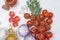 Bunch of tomatoes with garlic, rosemary, curry and chili pepper