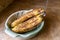 Bunch of very ripe bananas in serving bowl on counter