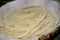 Bunch the white cream color unleavened bread in the cloth and basket