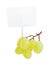 Bunch of a white grapes with blank cardboard information tag