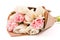 Bunch of white and pink double tulips wrapped in recycled brown paper isolated on white background.