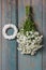 Bunch of white tiny chrysanthemums and white wicker wreath