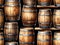 A Bunch Of Wooden Barrels Sitting Next To Each Other. Generative AI