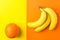 Bunch of yellow ripe bananas orange on duotone background. Creative trendy flat lay. Tropical theme. Healthy food clean eating