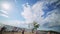 Bunch of young attractive people joyfully play valleyball on sunny summer beach