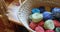 Bunches of different coloured woollen yarn kept in basket 4k