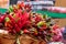 Bunches of red and green hot chili peppers in a basket