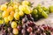 Bunches of ripe grapes against a linen canvas