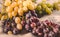 Bunches of ripe grapes on a linen cloth background