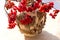 Bunches of viburnum in a vase. Red berries of rowan, viburnum, bright autumn berries in a vase on a light background. Branches of