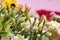 Bunches of white alsrtomeria in the flowers shop, sunflowers in the background