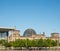 The Bundestag building, Berlin Germany. Parliament of the Federal Republic of Germany, with German flags flying outside.