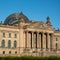 The Bundestag building, Berlin Germany. Parliament of the Federal Republic of Germany, with German flags flying outside.