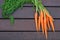 Bundle of carrots on the wood