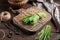 A bundle of fresh barley grass on a rustic table