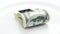 Bundle of many 100 dollar bank notes rotating