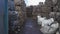 Bundle of pressed plastic bottles prepared for a garbage recycling on waste recycling plant. Camera moves to the side