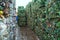 Bundle of pressed plastic bottles prepared for a garbage recycling on waste recycling plant. Pollution problem