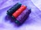 Bundles of Colorful Threads on Purple Fabric, Suitable for Weaving or Sewing Purpose