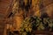 Bundles of dried herbs hung on a wooden wall.