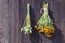 Bundles of fresh herbs hanged to dry on a wooden wall