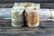 Bundles, rolls, stacks and piles of Egyptian money currency cash banknotes rolled up with rubber bands in different bill values of