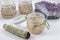 Bundles of Sage with amethyst and jars of beauty product