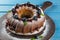 Bundt cake with icing sugar and blueberry