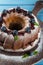 Bundt cake with icing sugar and blueberry