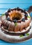 Bundt cake with icing sugar and blueberry